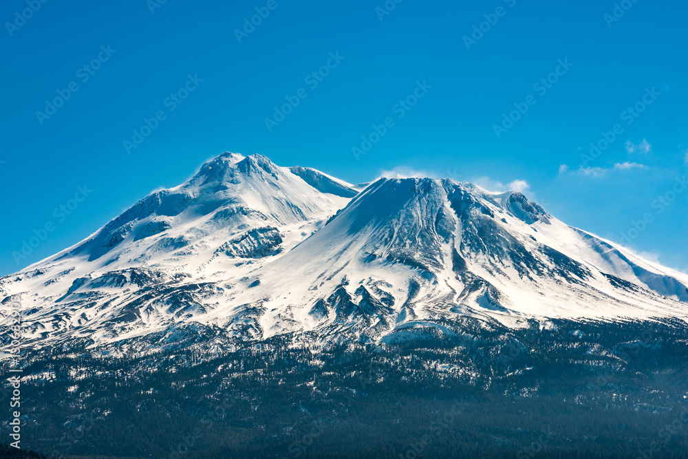 Snowcapped Mount Shasta volcano during winter blue closeup