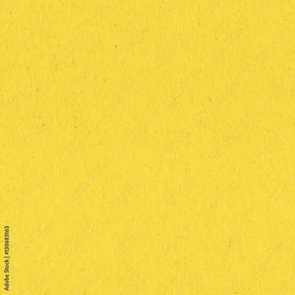 Seamless yellow construction paper background wallpaper. Stock Photo