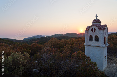Small church or chapel with typical Greek landscape at sunset, Sithonia, Greece