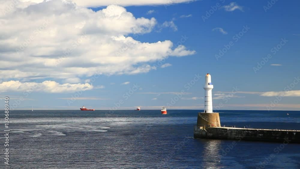 Lighthouse and Shoreline with a Supply Boat in Aberdeen, Scotland on Sunny Day
Lighthouse and Shoreline with a Supply Boat in Aberdeen, Scotland on Sunny Day