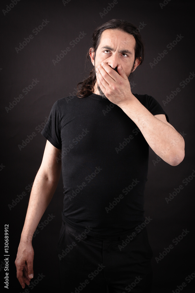 Handsome man doing different expressions in different sets of clothes: tired Handsome man doing different expressions in different sets of clothes: tired
