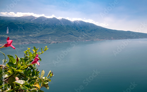 Lake Garda surrounded by mountains with copy space.