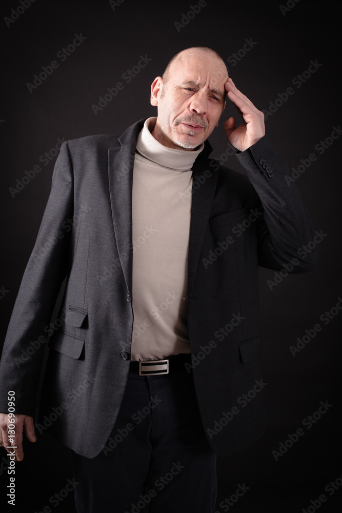 Handsome man doing different expressions in different sets of clothes: headache Handsome man doing different expressions in different sets of clothes: headache