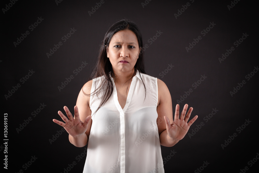 Beautiful woman doing different expressions in different sets of clothes: stop sign Beautiful woman doing different expressions in different sets of clothes: stop sign