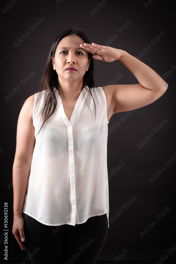 Beautiful woman doing different expressions in different sets of clothes: at attention Beautiful woman doing different expressions in different sets of clothes: at attention