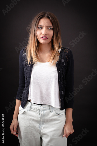 Beautiful woman doing different expressions in different sets of clothes: worried