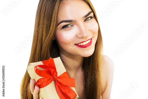 Beautiful young woman with present with red ribbon © Veselka