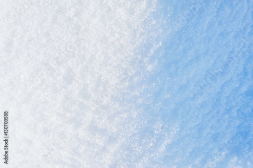 Winter background. Sparkling blue snow