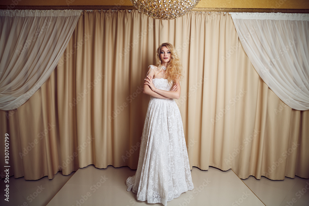 Full length portrait of beauty bride in white dress. Classic sty