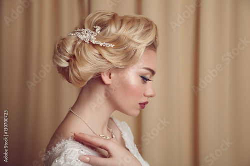 Portrait of beauty bride in white dress with classic hairstyle.