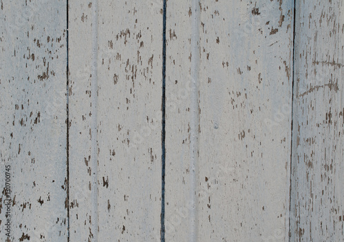 Wood painted a faded old paint peeling off a stunning clinched.