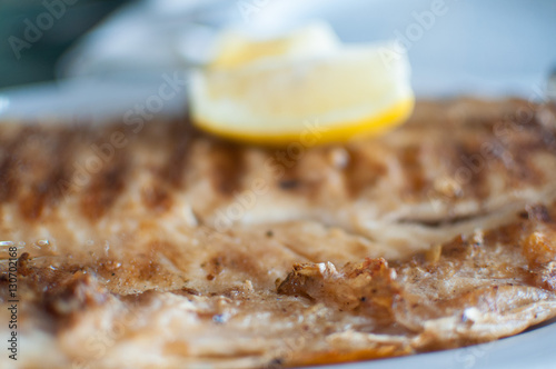 Grilled fish fillet on barbecue with lemon - Boga (Leporinus obtusidens). photo