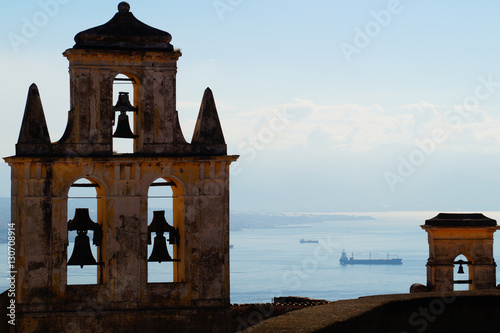 Church in Napoli in front of ocean photo