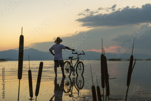 bisikletle doğa gezisi ve günbatımı photo