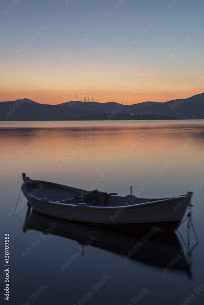 Beautiful sunset with fishing boat Beautiful sunset with fishing boat