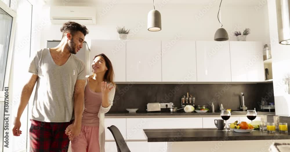 Young Mixed Race Couple Embrace Morning Sunlight, Cute Happy Hispanic Man Asian Woman Together In Kitchen Slow Motion Young Mixed Race Couple Embrace Morning Sunlight, Cute Happy Hispanic Man Asian Woman Together In Kitchen Slow Motion