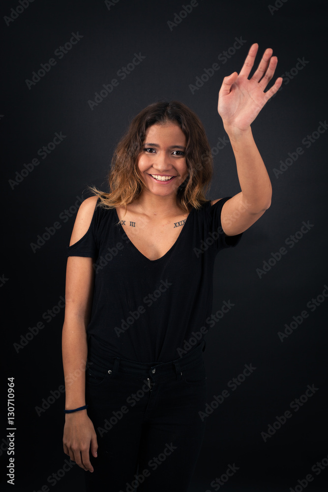 Beautiful woman doing different expressions in different sets of clothes: wave Beautiful woman doing different expressions in different sets of clothes: wave