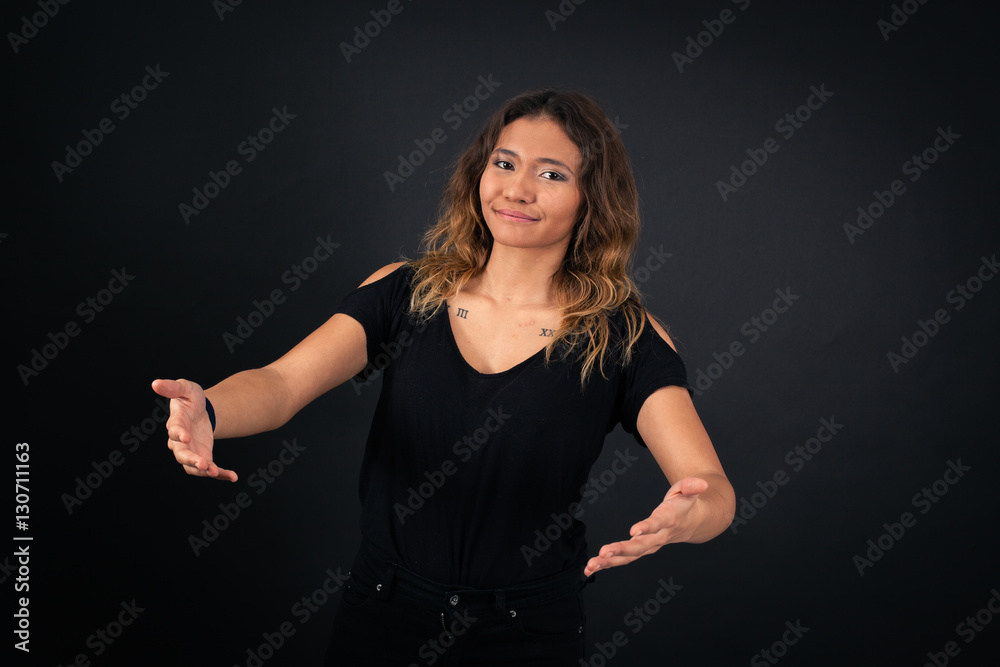 Beautiful woman doing different expressions in different sets of clothes: welcome Beautiful woman doing different expressions in different sets of clothes: welcome