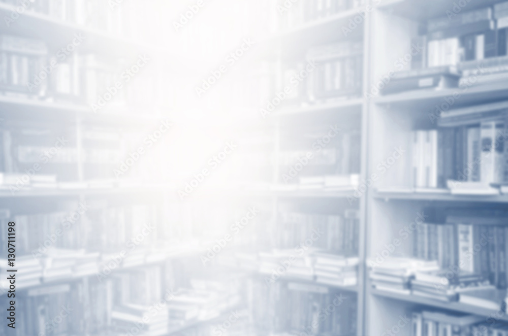 blurred bookshelf in library for your background design Stock Photo