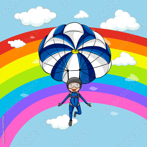 Fototapeta Naklejka Na Ścianę i Meble -  Man parachuting in the sky with rainbow background