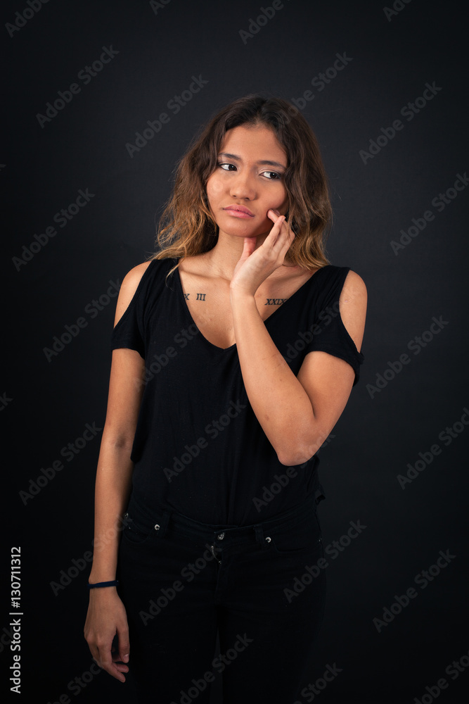 Beautiful woman doing different expressions in different sets of clothes: toothache Beautiful woman doing different expressions in different sets of clothes: toothache
