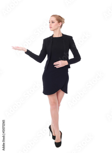 full length portrait of young woman wearing black professional office outfit. standing pose, isolated against white background.