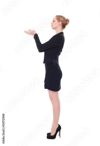 full length portrait of young woman wearing black professional office outfit. standing pose, isolated against white background.