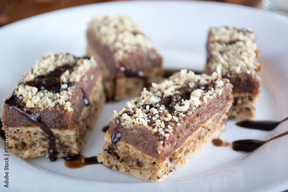 Chocolate cake with walnut cut into squares