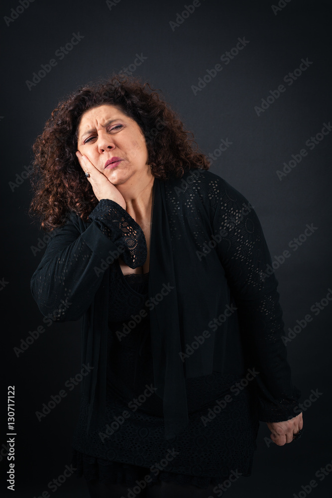 Beautiful woman doing different expressions in different sets of clothes: toothache