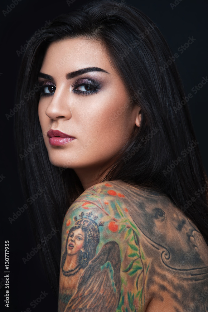 Portrait of young beautiful sexy woman with gorgeous tattoo on her body  Stock Photo | Adobe Stock