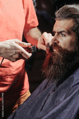 Handsome bearded man in barbershop