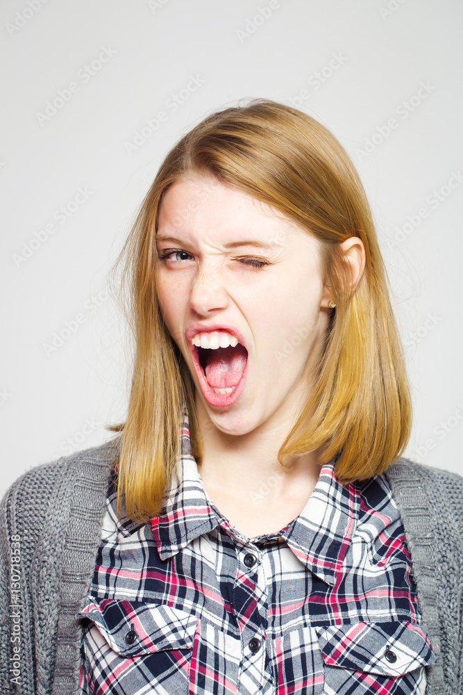 Angry pretty girls shows teeth Angry pretty girls shows teeth