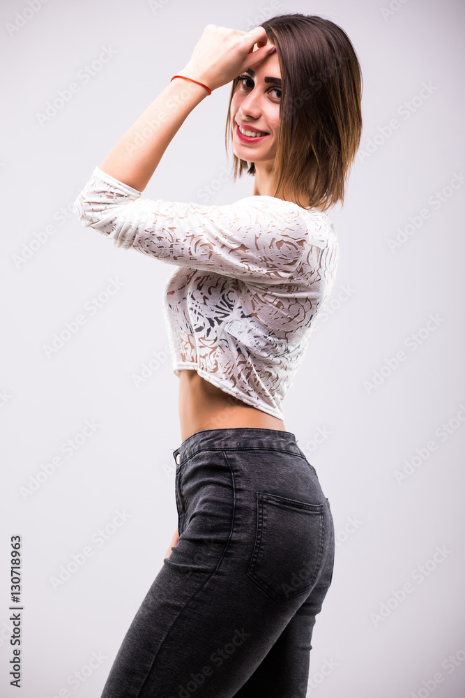 portrait of cheerful fashion hipster girl going crazy in casual hipster clothes isolated on white portrait of cheerful fashion hipster girl going crazy in casual hipster clothes isolated on white