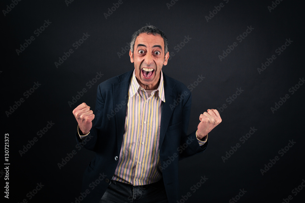 Handsome man doing different expressions in different sets of clothes: arms raised Handsome man doing different expressions in different sets of clothes: arms raised