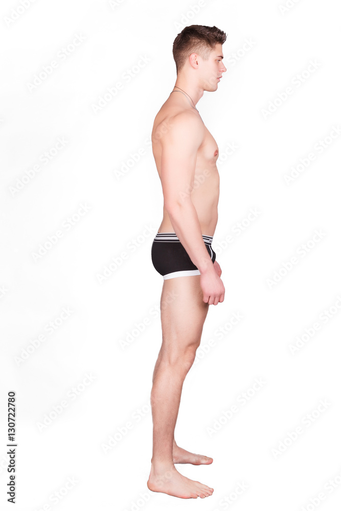 Muscular athletic man boxing on a black background. A man with a naked torso in shorts, hands peremotanye bandages for boxing. Muscular athletic man boxing on a black background. A man with a naked torso in shorts, hands peremotanye bandages for boxing.