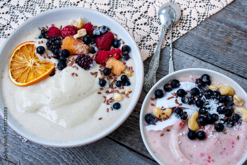 Smoothie bowl, banana ice cream with berries, nuts, flax. Perfect for the detox diet or just a healthy meal. Love for a healthy raw food concept. Smoothie bowl, banana ice cream with berries, nuts, flax. Perfect for the detox diet or just a healthy meal. Love for a healthy raw food concept.