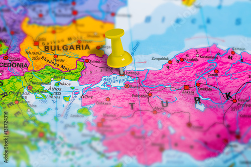 Istanbul city in Turkey pinned on colorful political map of europe. Geopolitical school atlas. Tilt shift effect.