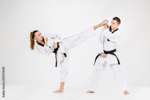 The karate girl and boy with black belts