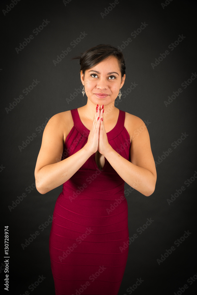 Beautiful woman doing different expressions in different sets of clothes: prayer Beautiful woman doing different expressions in different sets of clothes: prayer