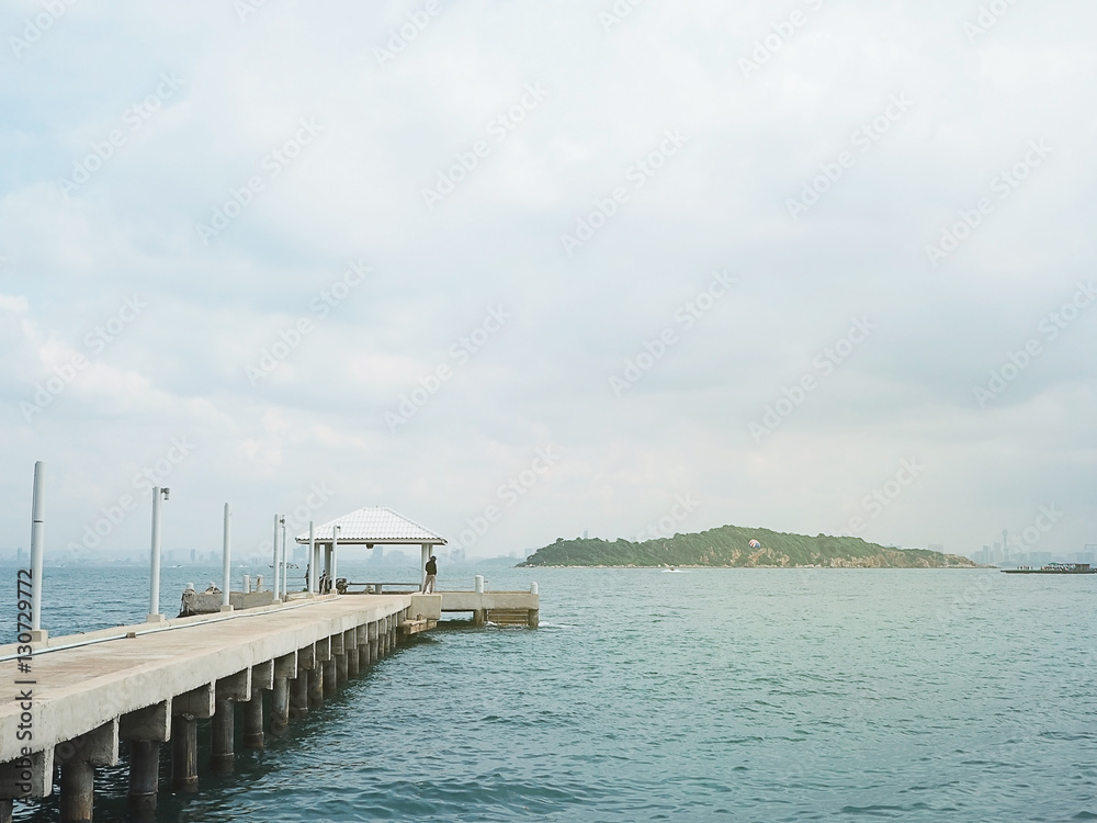 Obraz premium concrete pier on sea/ocean with blue sky background in Thailand.