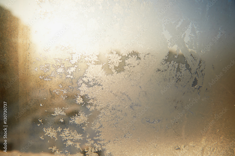 Frosty patterns on glass. Winter Christmas mood. Texture, close