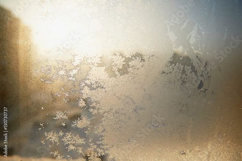 Frosty patterns on glass. Winter Christmas mood. Texture, close