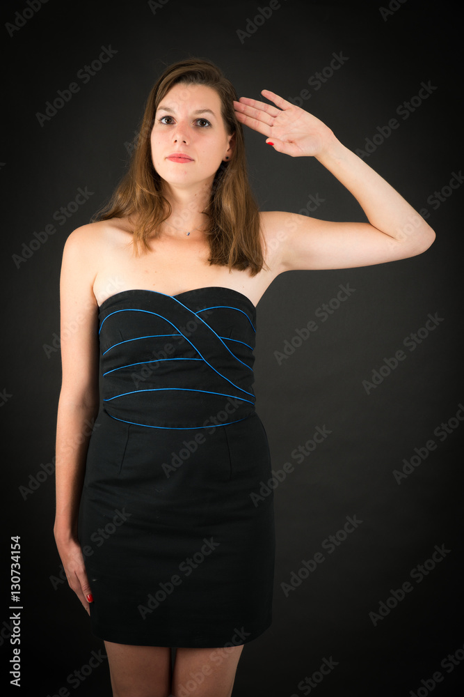 Beautiful woman doing different expressions in different sets of clothes: at attention Beautiful woman doing different expressions in different sets of clothes: at attention