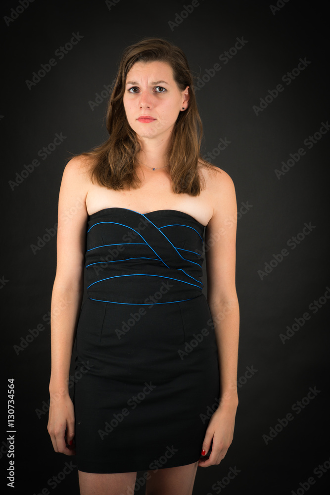 Beautiful woman doing different expressions in different sets of clothes: sad Beautiful woman doing different expressions in different sets of clothes: sad