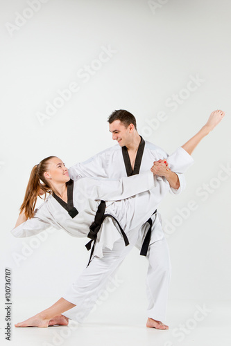 The karate girl and boy with black belts