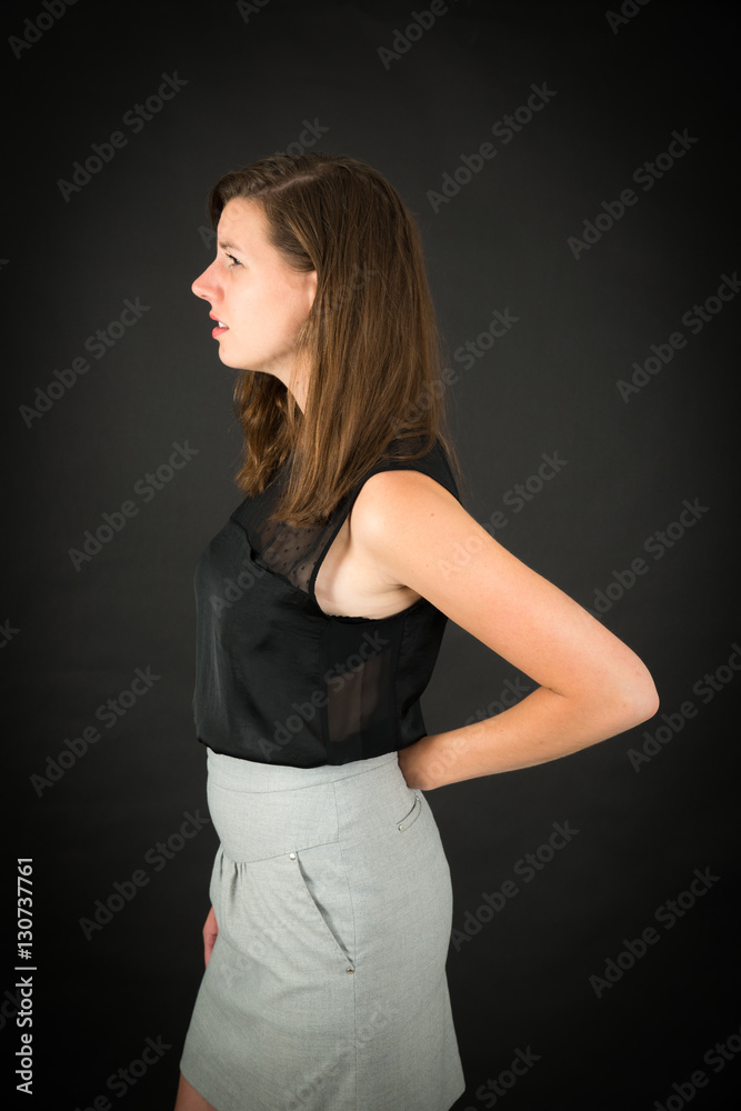 Naklejka premium Beautiful woman doing different expressions in different sets of clothes: backache