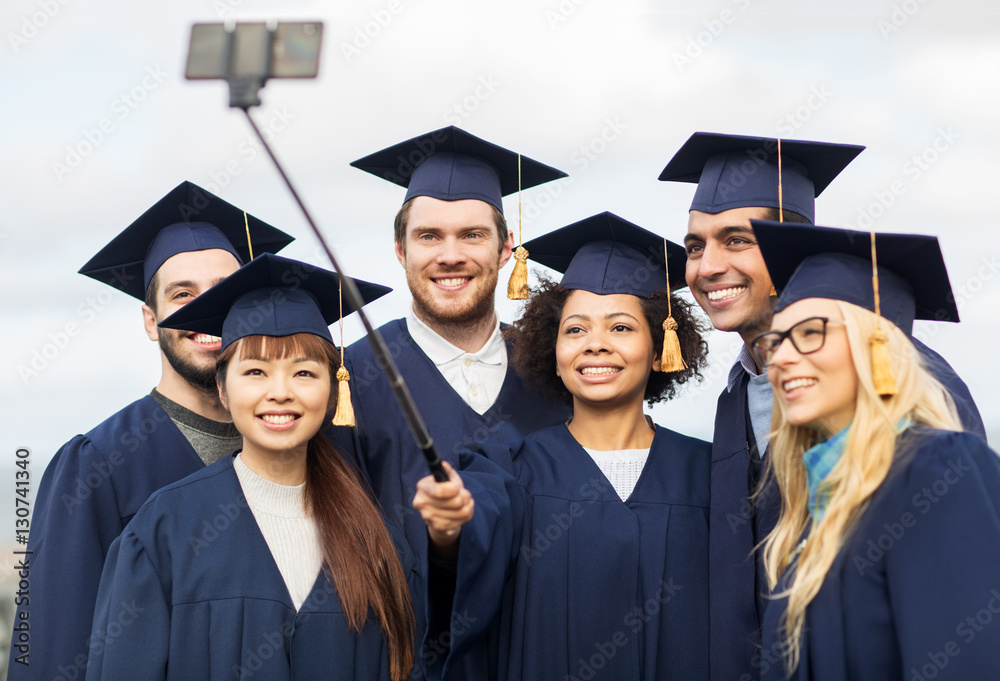 students or bachelors taking selfie by smartphone students or bachelors taking selfie by smartphone