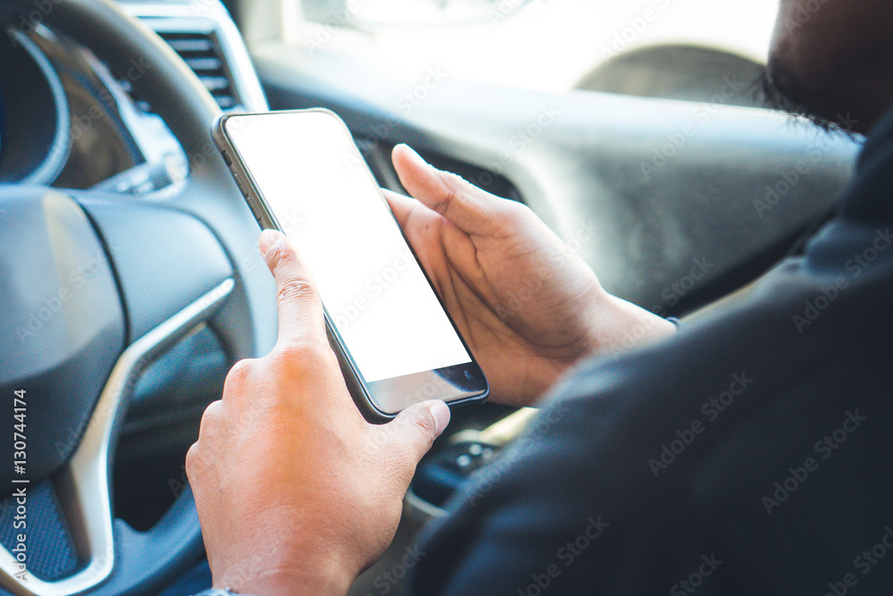 woman's holding empty screen of smart-phone inside a car