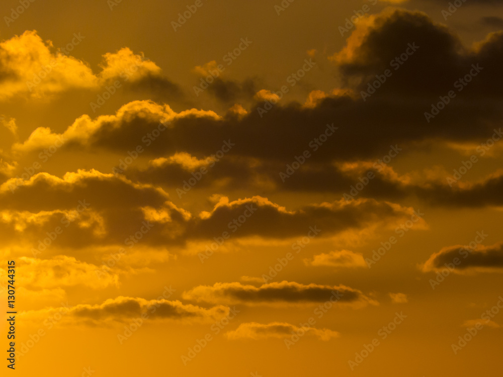 Deep orange sky with clouds for use as background.