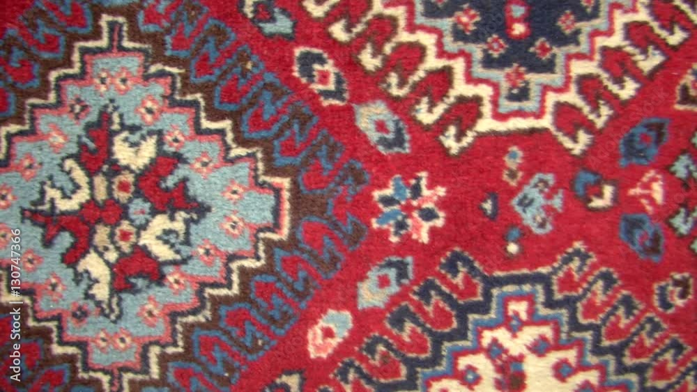 Close up of persian carpet, horizontal tracking